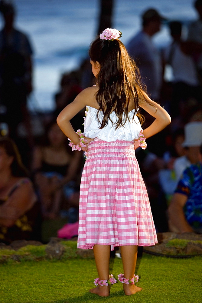 Rear view of a girl standing on the beach, Waikiki Beach, Honolulu, Oahu, Hawaii Islands, USA