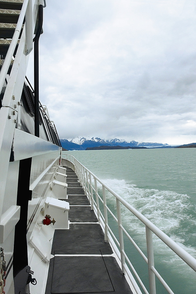 Yacht in a lake with mountains in the background, Lake Argentino, Patagonia, Argentina