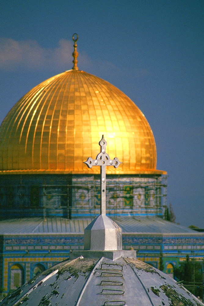 Cross on the dome of a church with a mosque in the background, Dome Of The Rock, Jerusalem, Israel