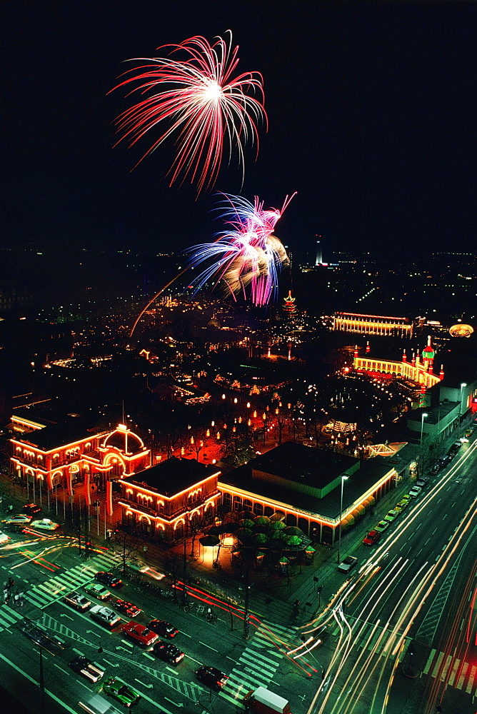 Aerial view of buildings in a city lit up at night, Tivoli Gardens, Copenhagen, Denmark