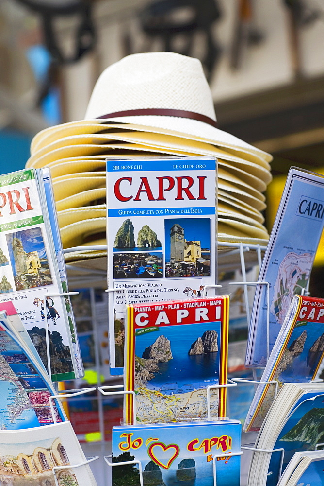 Magazines and sun hats at a market stall, Capri, Campania, Italy