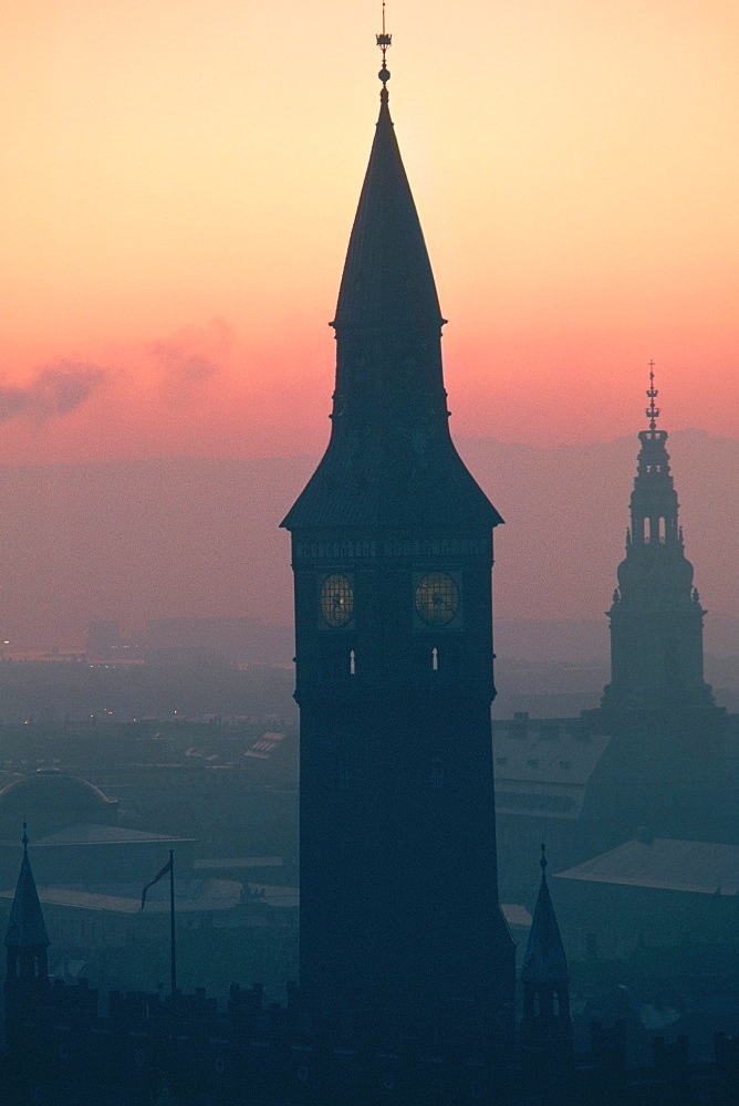 Silhouette of a clock tower at dusk, City Hall, Copenhagen, Denmark