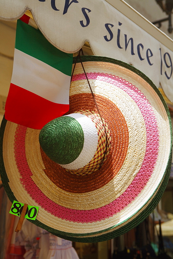 Sun hat hanging at a market stall, Sorrento, Sorrentine Peninsula, Naples Province, Campania, Italy