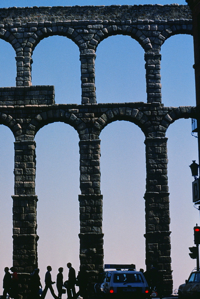 Tourist near roman aqueducts, Segovia, Spain