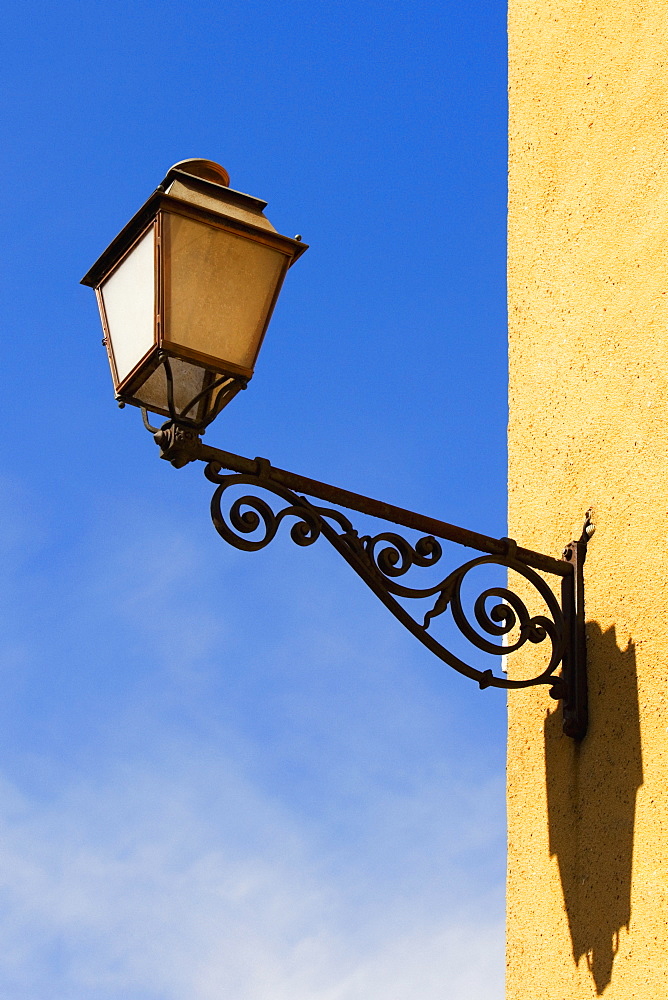 Low angle view of a lantern mounted on the wall, Le Mans, Sarthe, Pays-de-la-Loire, France