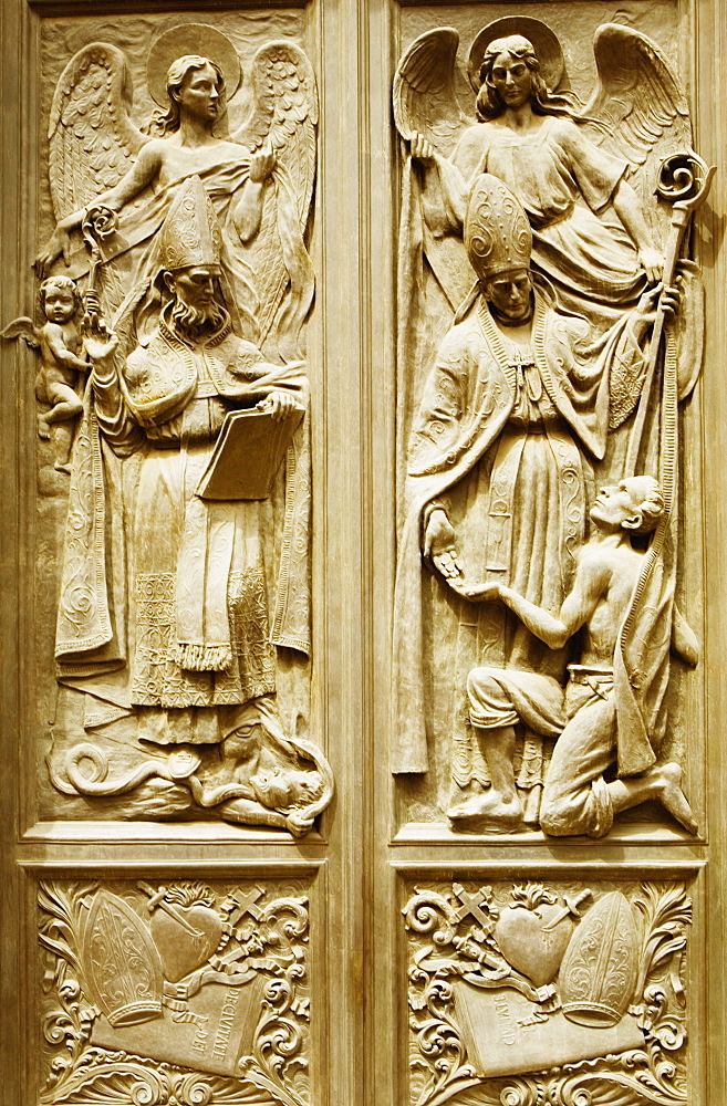 Bas relief on the door of a church, Chiesa Di Nostra Signora Della Consolazione, Genoa, Liguria, Italy