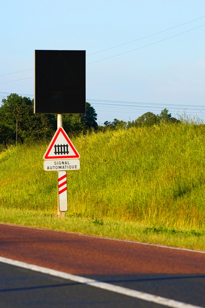 Railroad crossing signboard at the roadside, Loire Valley, France