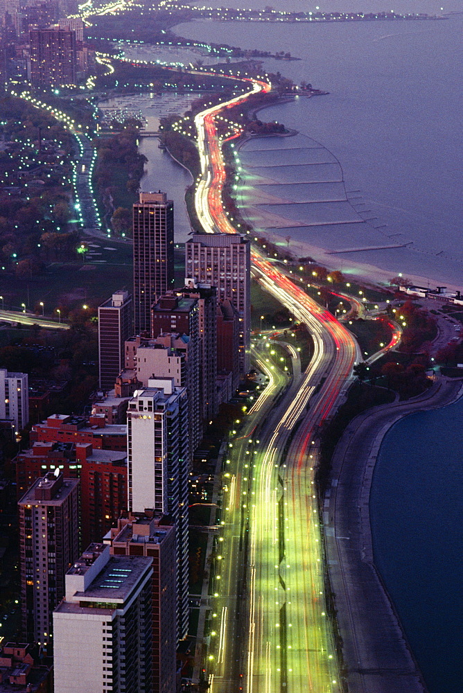 Aerial view of buildings along a highway in a city, Lake Michigan, Chicago, USA