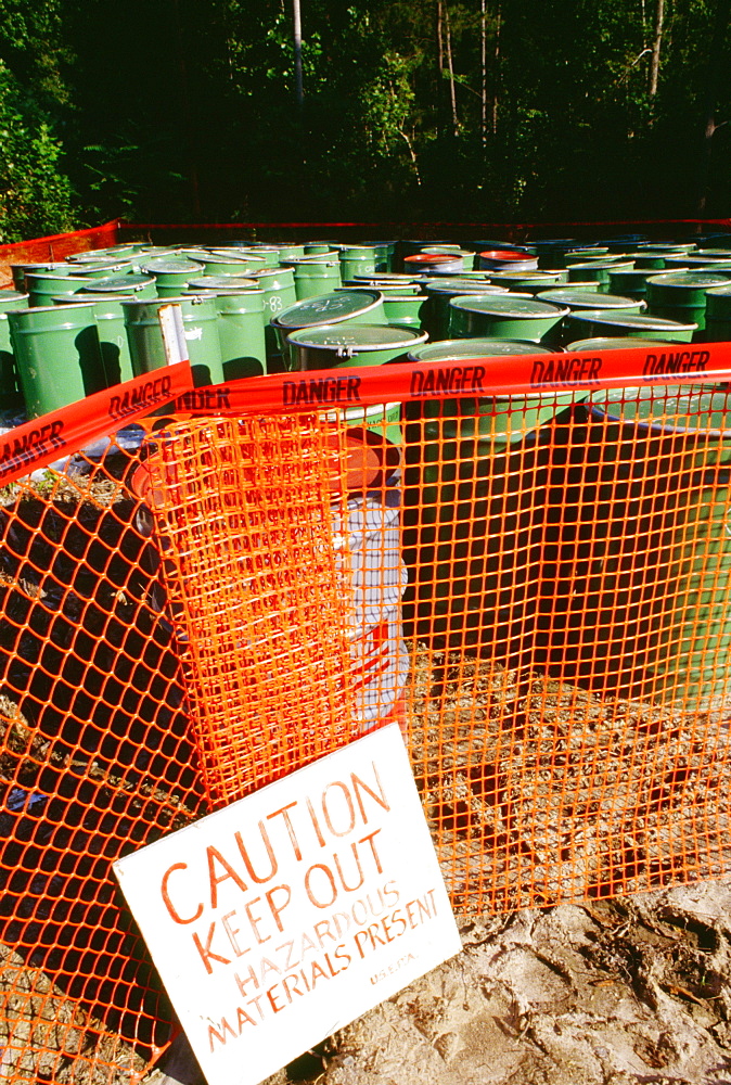 Warning sign in front of barrels of toxic waste, Virginia, USA