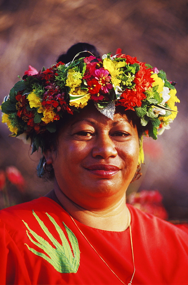 Portrait of a mid adult woman wearing a laurel wreath, Hawaii, USA