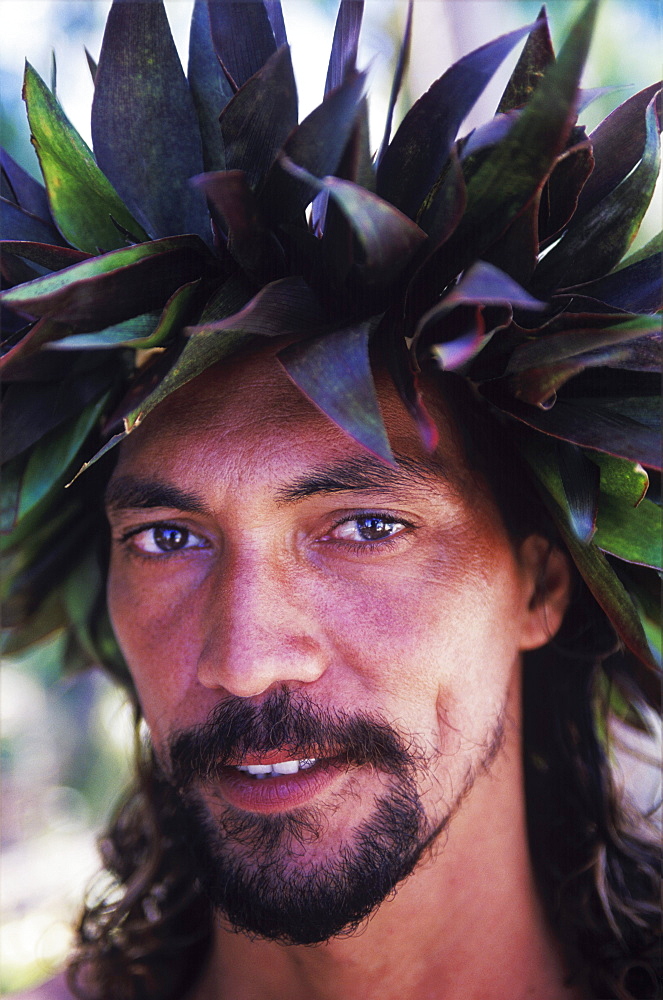 Portrait of a young man wearing a headdress, Hawaii, USA