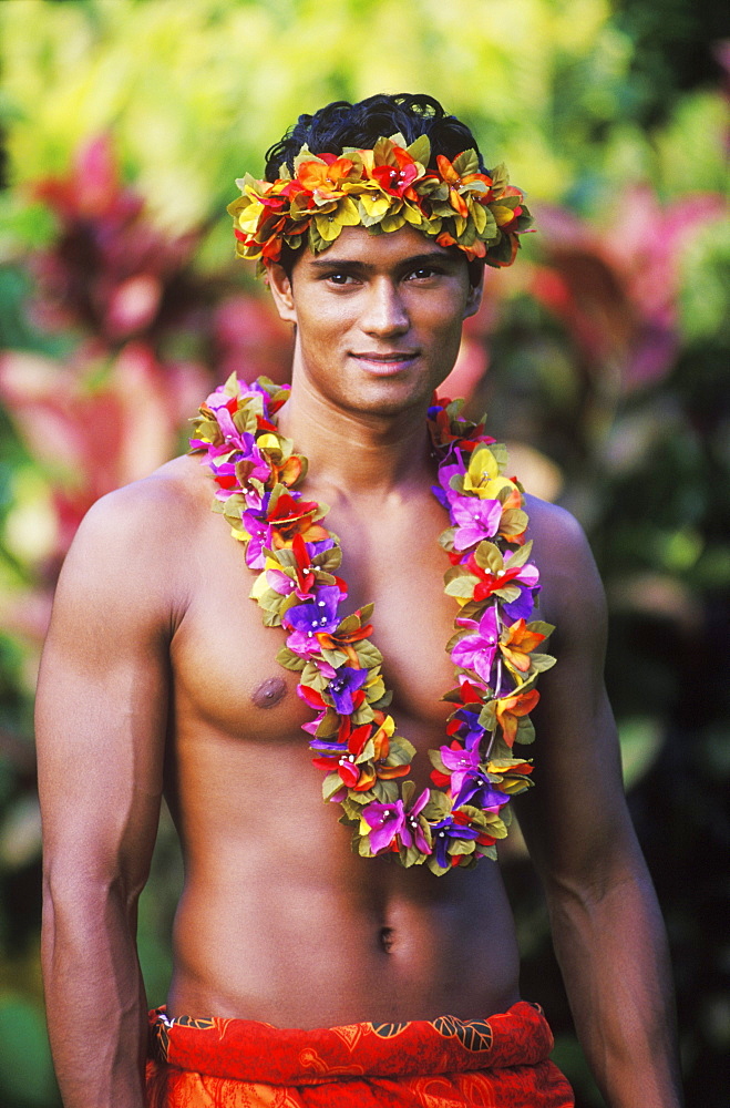 Portrait of a young man wearing a garland, Hawaii, USA