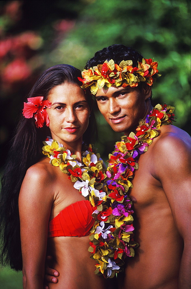 Portrait of a young couple standing together, Hawaii, USA