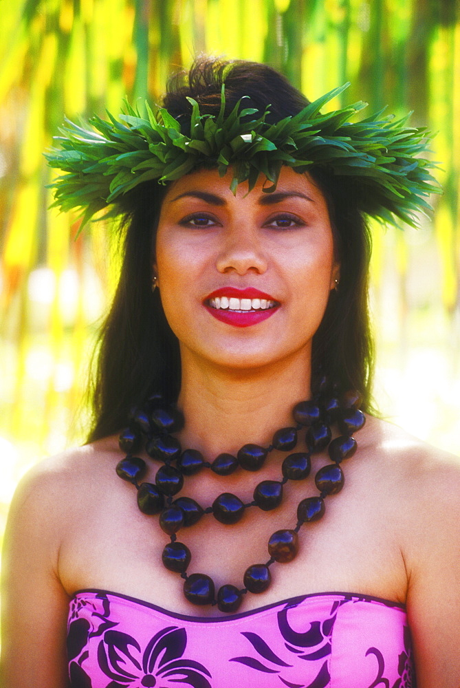 Portrait of a Hawaiian hula dancer smiling, Hawaii, USA