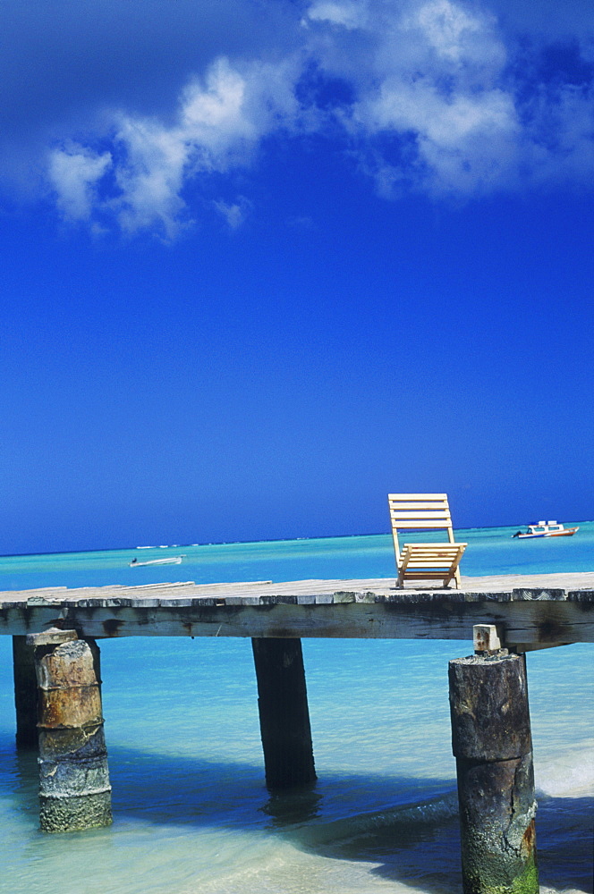 Deck chair on a pier, Caribbean