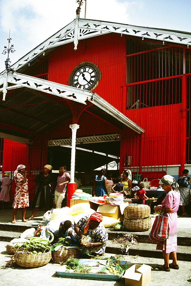 Small group of vendors busy selling the island produce to customers, St. Lucia