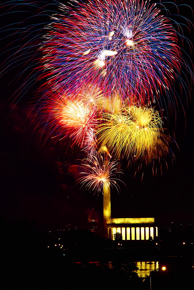 Low angle view of fire works display at night, Lincoln Memorial, Washington Monument, Washington DC, USA