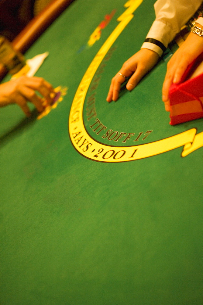 High angle view of person's hand on a gaming table, Las Vegas, Nevada, USA