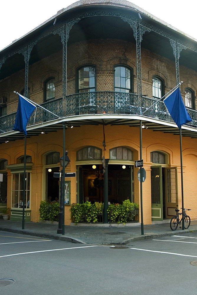 Two flags on the balcony of a building, French Quarter, New Orleans, Louisiana, USA