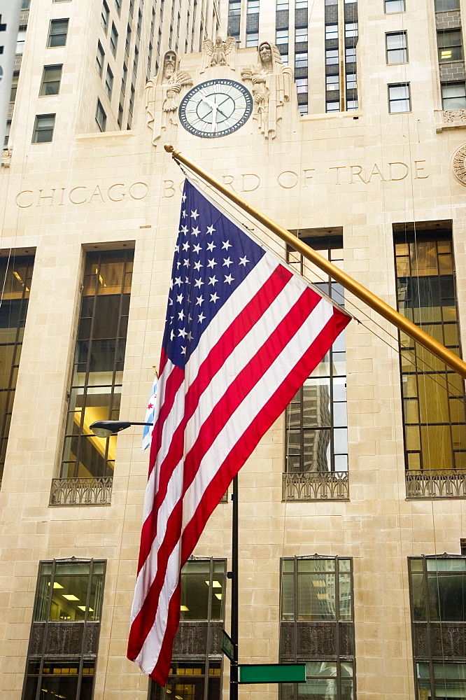 Low angle view of the American flag in front of a building, Chicago Board Of Trade, Chicago, Illinois, USA