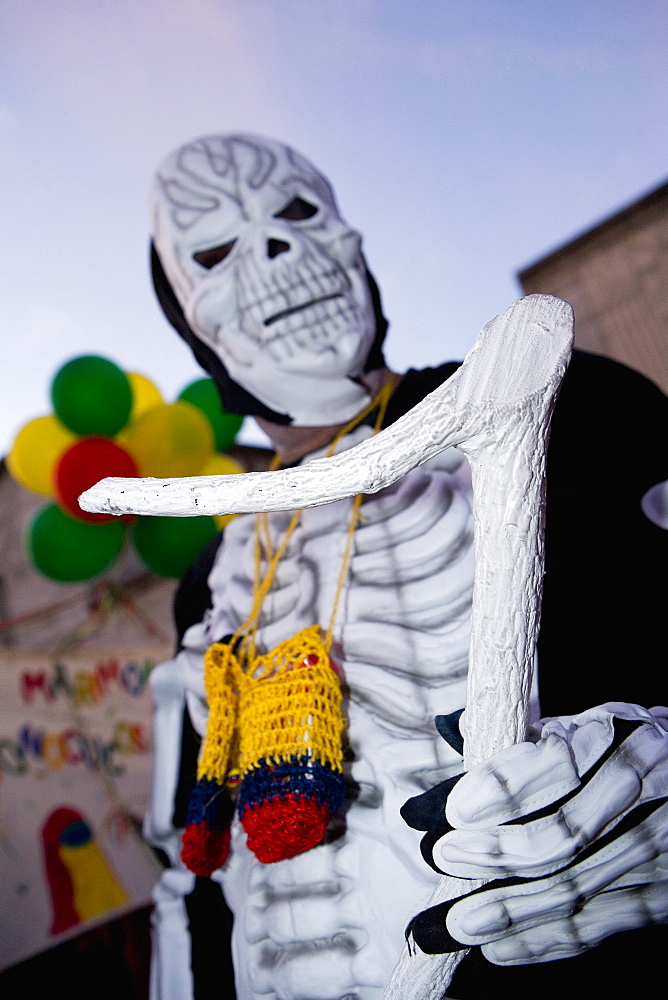 Low angle view of a man wearing a costume and a mask