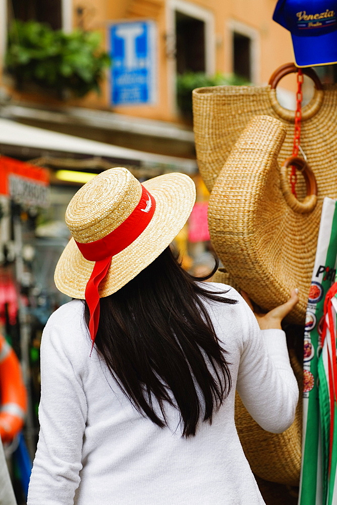 Rear view of a woman at a market stall