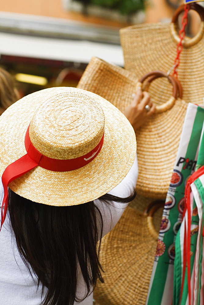 Rear view of a woman at a market stall