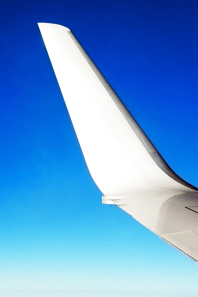 Close-up of an airplane wing in flight