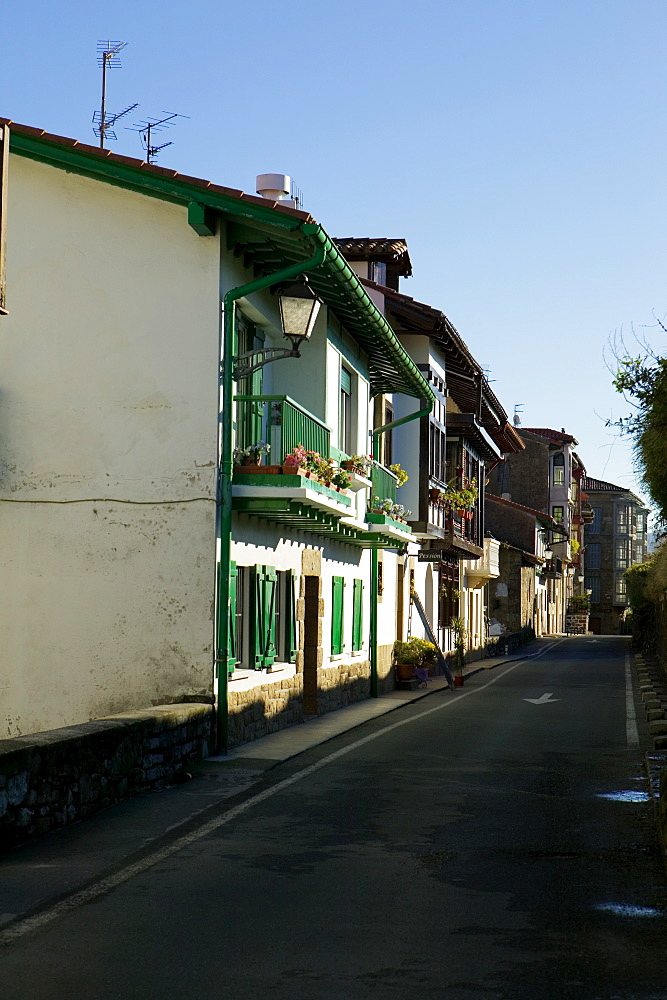 Empty street in front of residential buildings, Spain