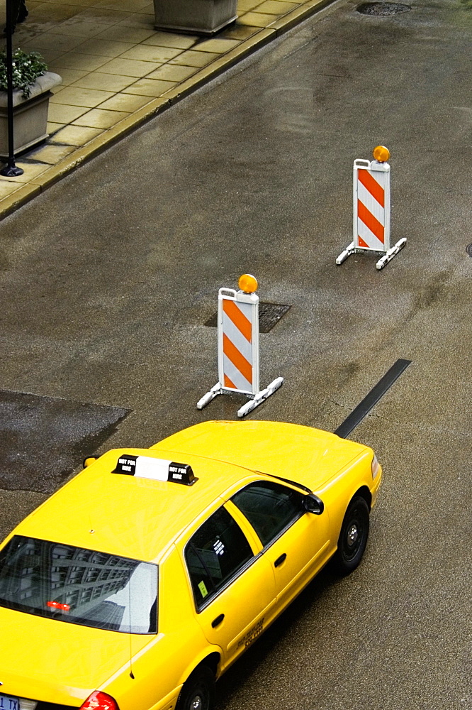 High angle view of a yellow taxi moving on the street, Chicago, Illinois, USA