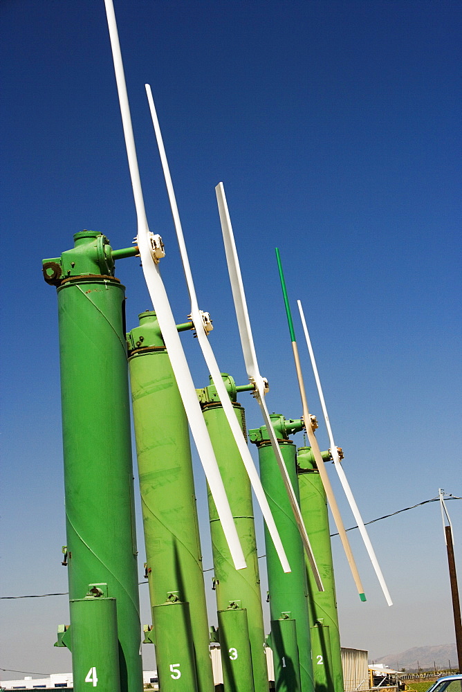 Side profile of an array of windmills on a farm