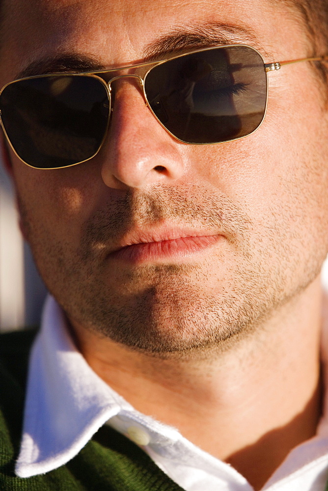 Close-up of a mid adult man wearing sunglasses