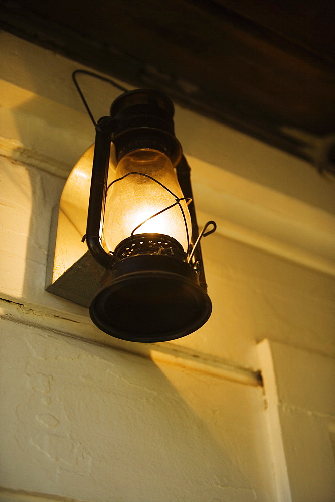 Low angle view of a lantern on a porch