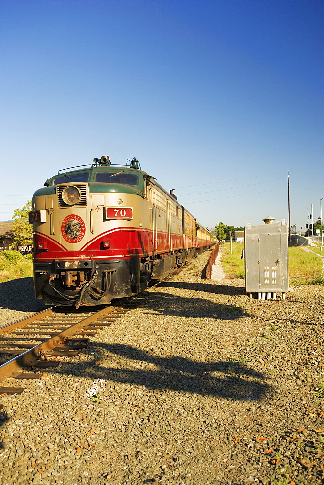 Commuter train moving on railroad track