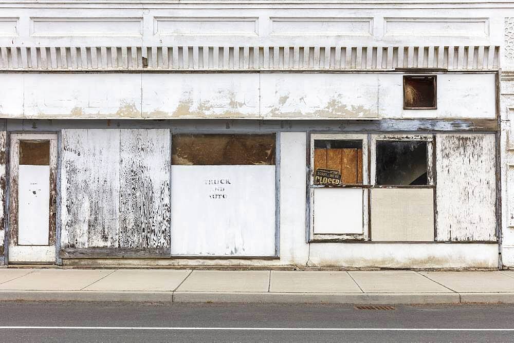 Abandoned storefronts and buildings on a deserted main street