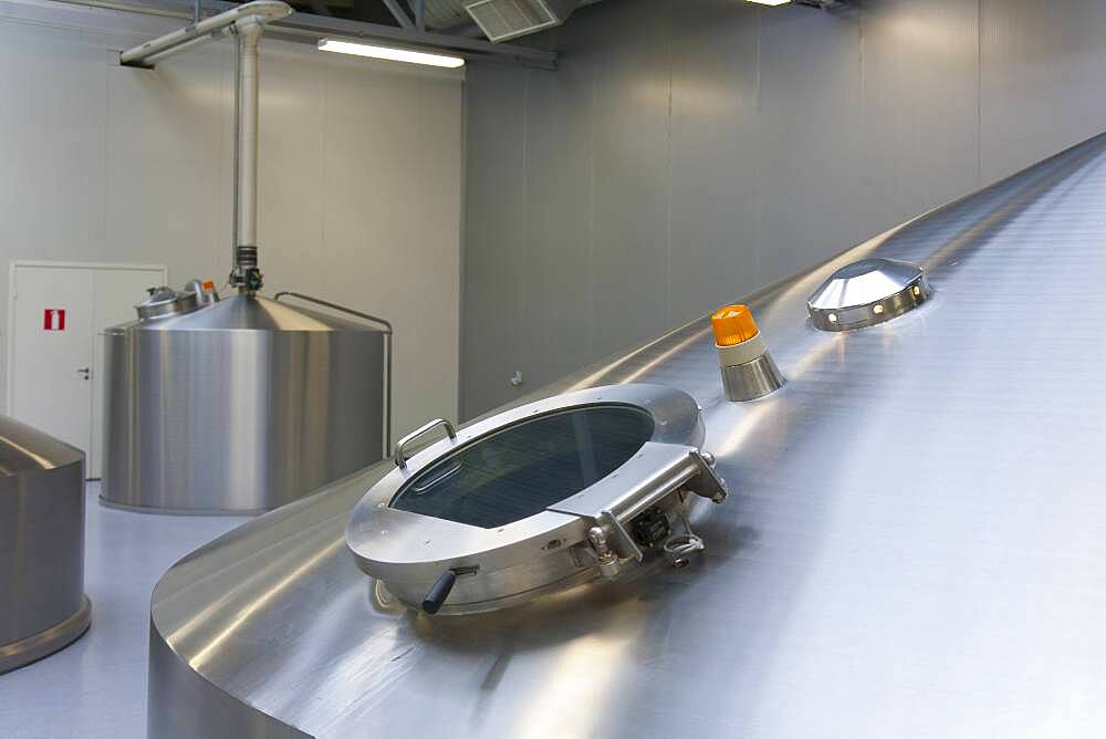 Steel brewery storage tanks with inspection hatch