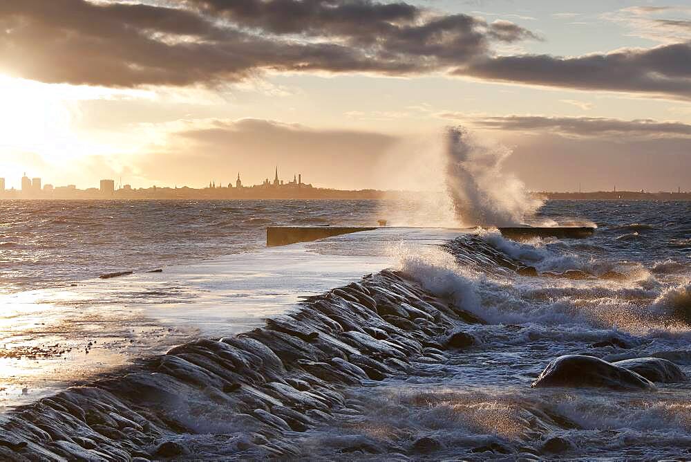 A weather storm in the Baltic Sea, waves crashing over a pier