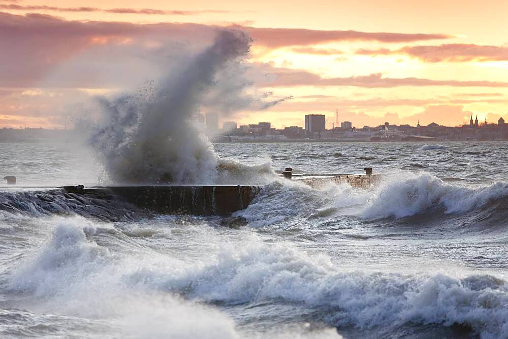 A weather storm in the Baltic Sea, waves crashing over a pier