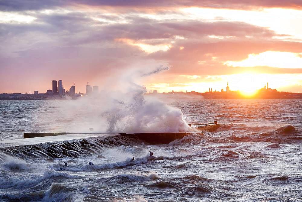 A weather storm in the Baltic Sea, waves crashing over a pier