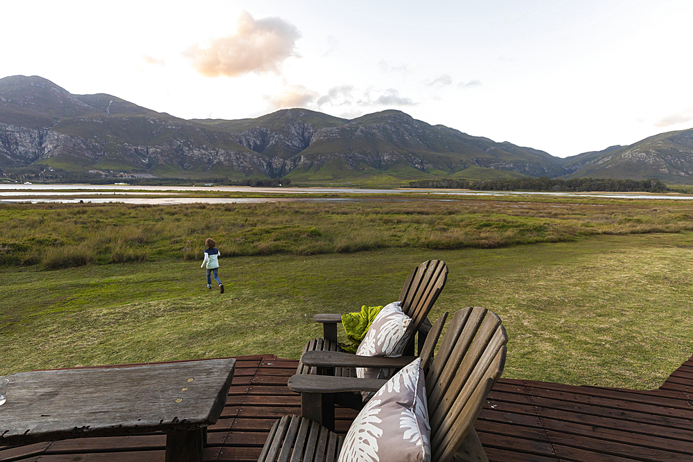 young boy exploring edge of lagoon,Stanford, Western Cape, South Africa