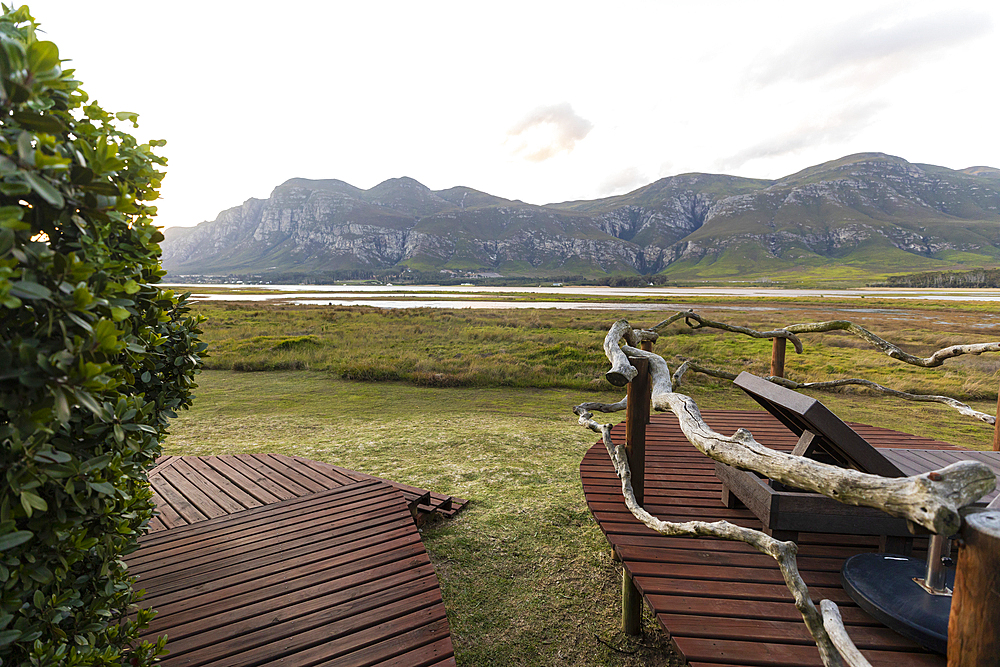 Boardwalk and open space on the shore of a lagoon