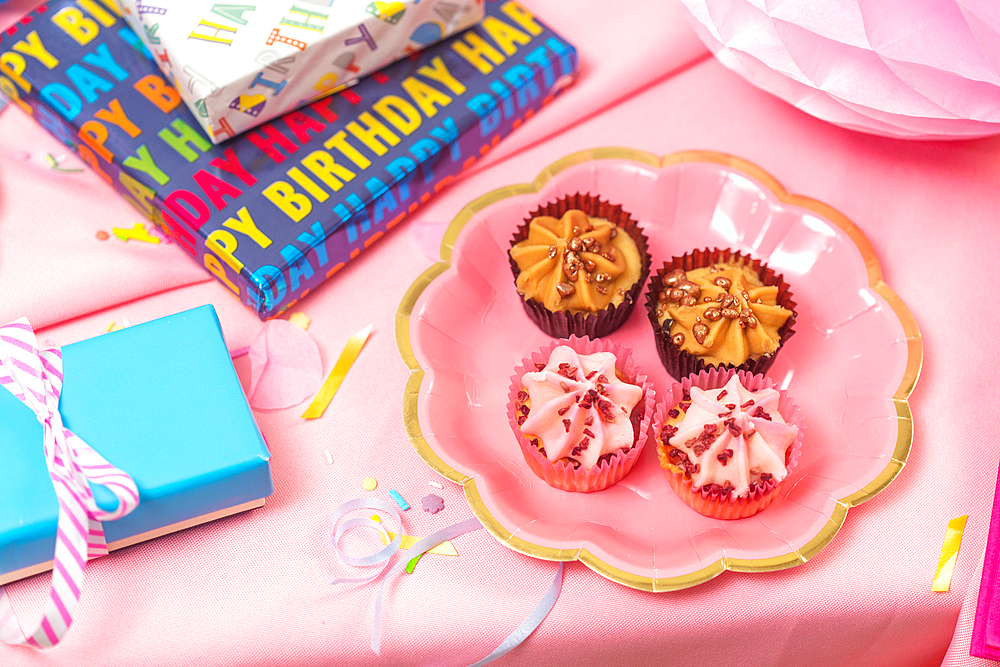 Birthday party table, with pink tablecloth