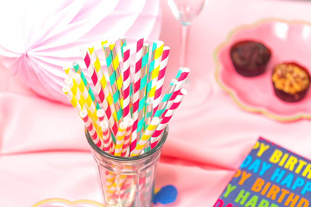 Birthday party table, with pink tablecloth