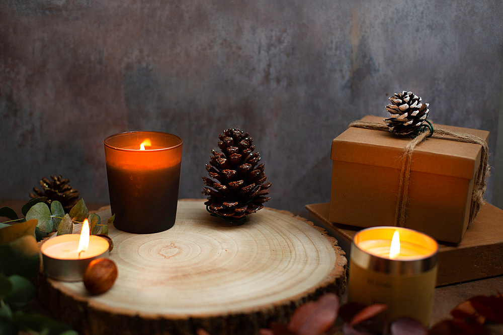 Christmas, wine glasses of mulled wine, lit candles and table decorations