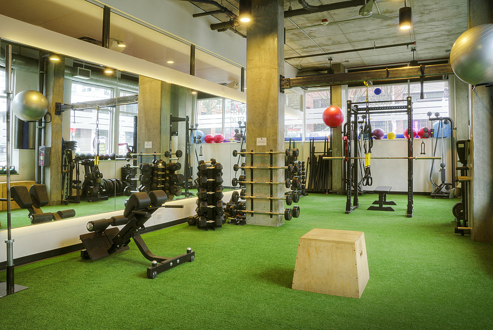 Weights room in an empty gym.