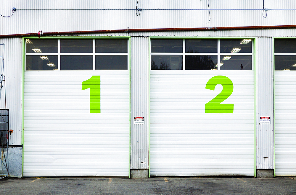 Numbers 1 and 2 On Repair Shop Bay Doors