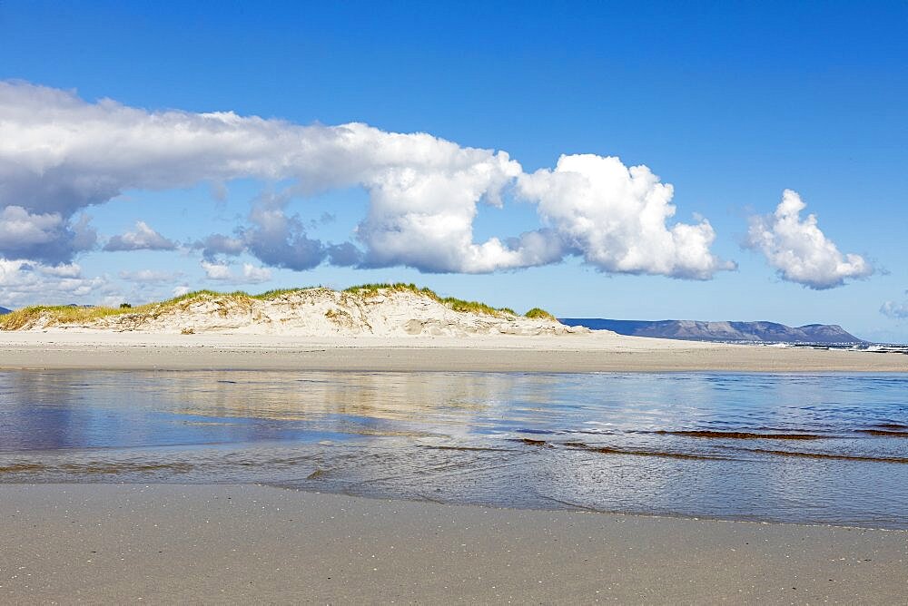 A wide open sandy beach and view along the coastline of the Atlantic ocean, Grotto Beach, Western Cape, South Africa