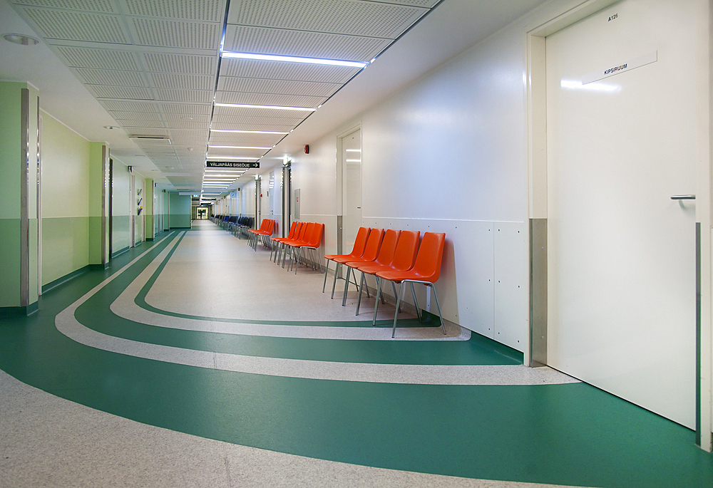 Corridor and waiting areas of a modern hospital with seating