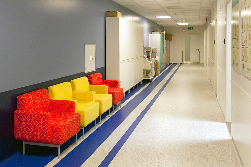 Corridor and waiting areas of a modern hospital with seating