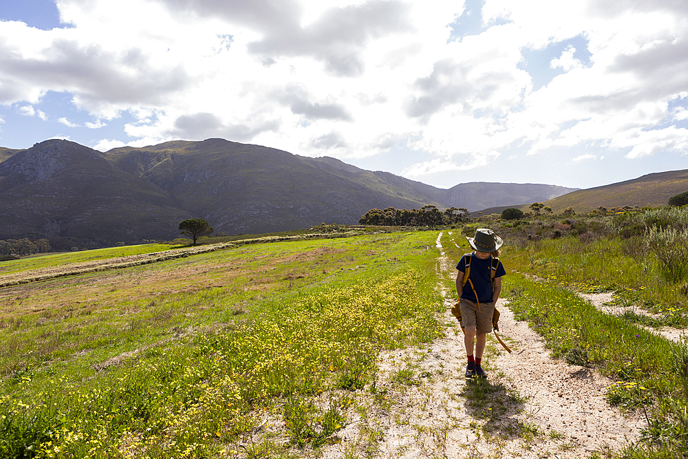 Young boy walking, Stanford Valley Guest Farm, Stanford, Western Cape, South Africa.